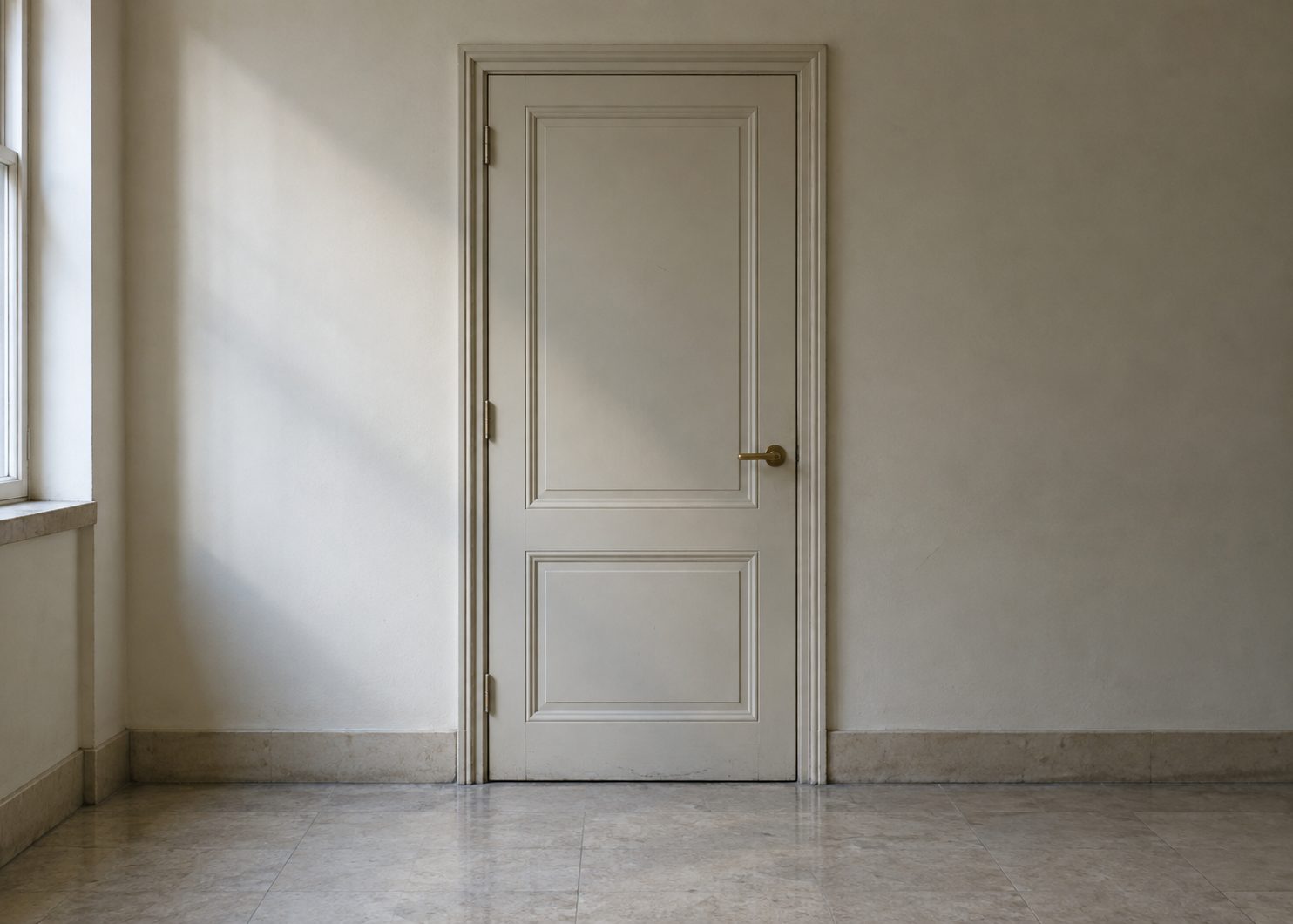 A closed door, interior, natural light
